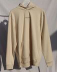 cream hoodie with embroidered centre logo