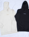 black and cream hoodie with embroidered centre logo  