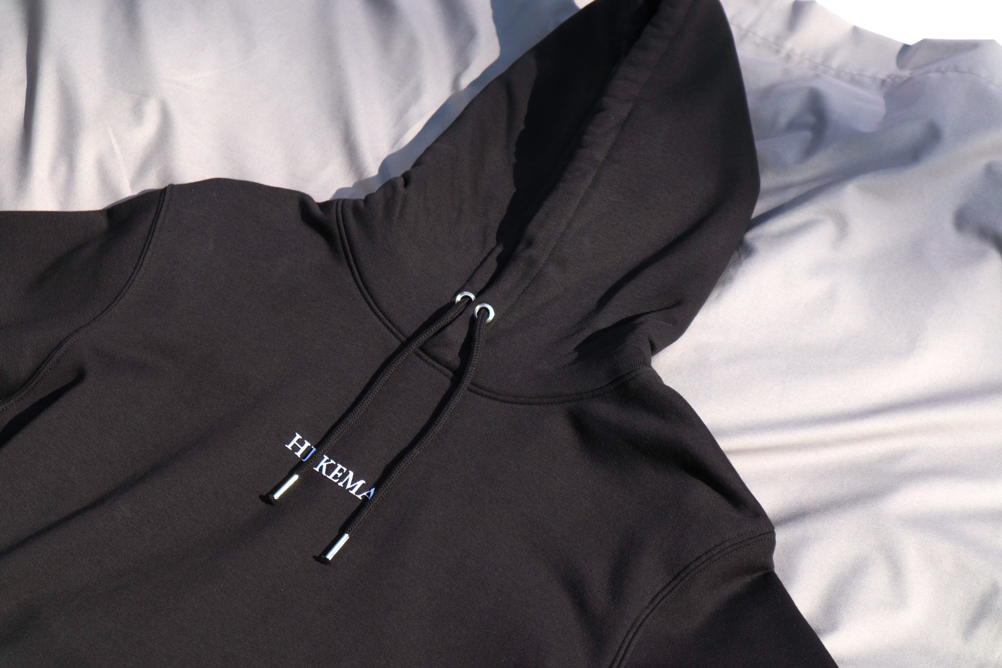 black hoodie with embroidered logo front 